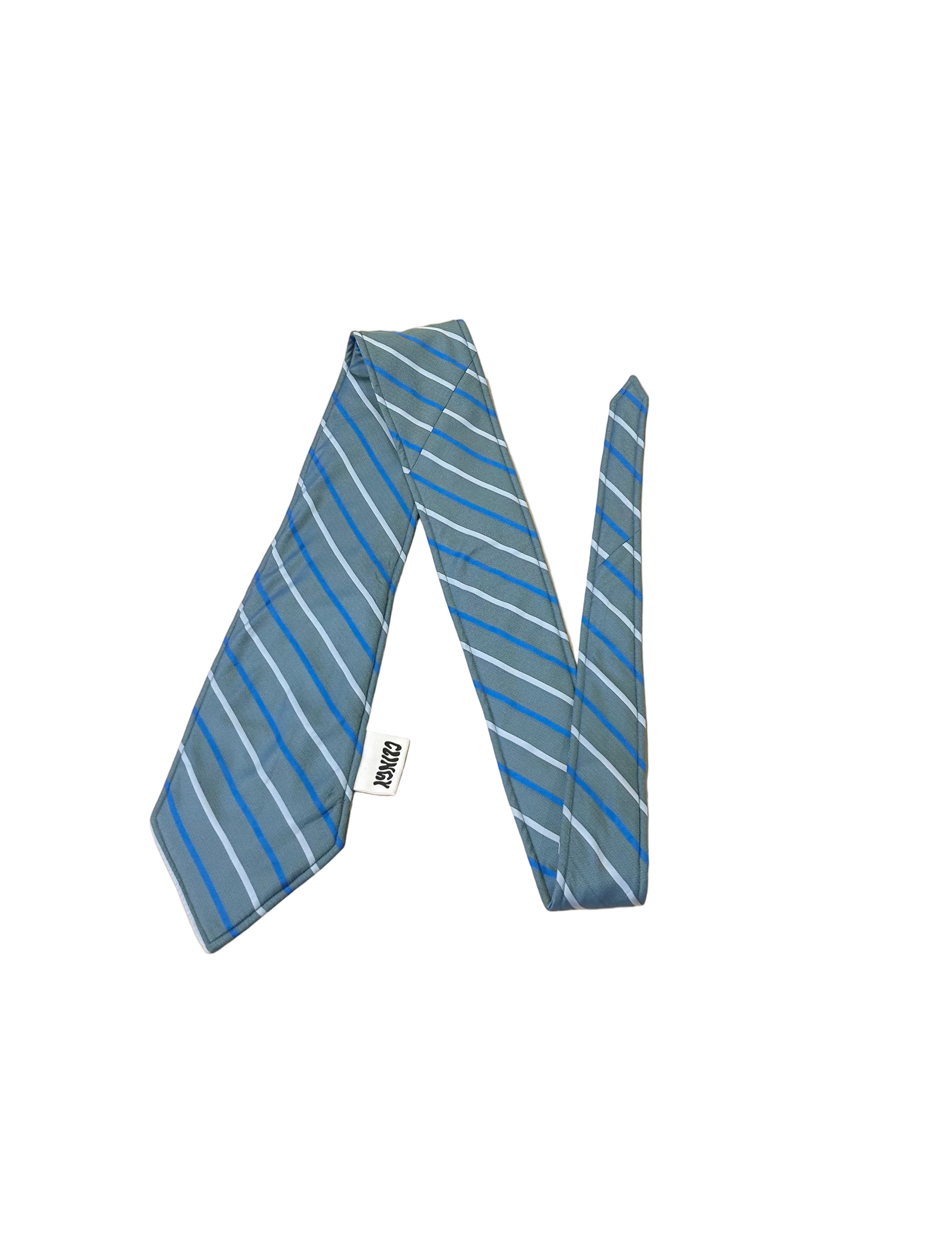 Blue and green striped tie on a beige surface with a blurred background